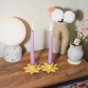 Yellow speckled star shaped candle holder set